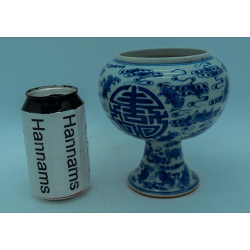 2989 - A Chinese blue and white stem cup decorated with bats 15cm.