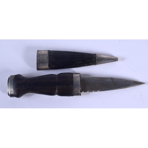 884 - AN ANTIQUE SCOTTISH SILVER CITRINE DIRK DAGGER. 18 cm long.