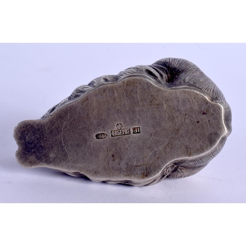 889 - A CONTINENTAL SILVER AND RUBY EYED FIGURE OF A RABBIT. 53 grams. 5.5 cm x 3 cm.