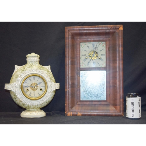 3002 - A Porcelain clock together with another wooden Regulator (2).