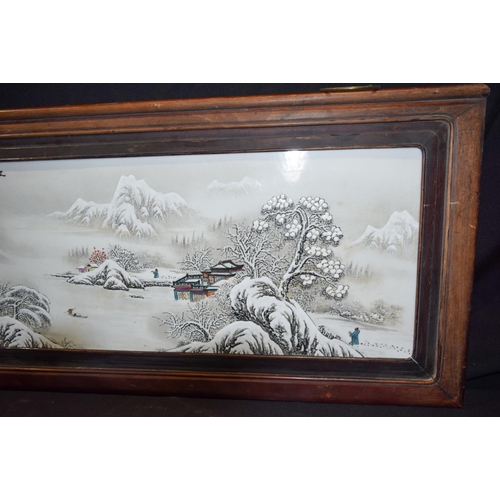 3006 - A Framed Chinese porcelain panel decorated with a snowy landscape 102 x 48 cm.