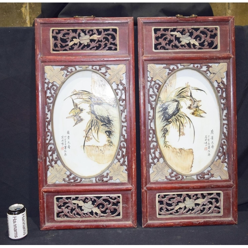 3007 - A Framed pair of Chinese porcelain panels decorated with birds and foliage 80 x 37cm. (2)