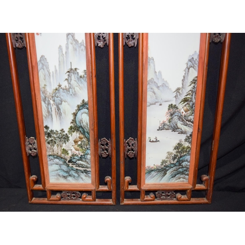 3008 - A framed pair of Famille Verte porcelain panels decorated with a landscape 68 x 28 cm (2)