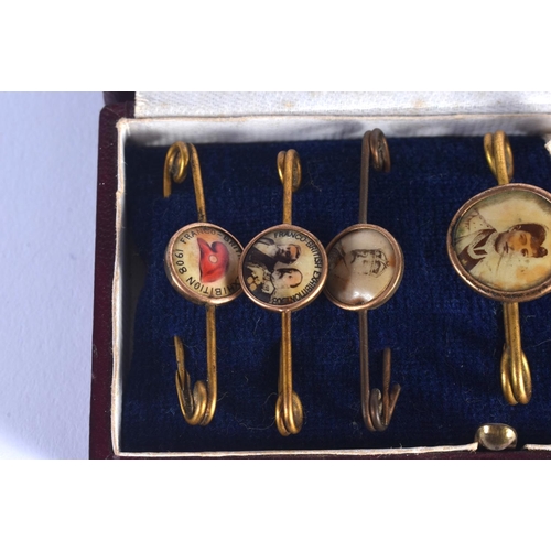 772 - SIX CASED ANTIQUE ENAMELLED PIN BADGES including the Franco British Exhibition 1908. (6)