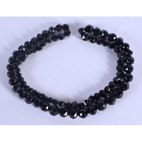 797 - A VINTAGE WHITBY JET NECKLACE. 86 cm long.