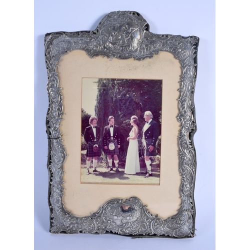 807 - A LARGE VICTORIAN SILVER FRAME decorated with figures within landscapes. Birmingham 1899. 1220 grams... 