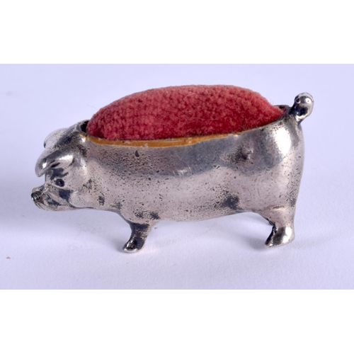 822 - AN ANTIQUE SILVER PLATED PIG PIN CUSHION. 33 grams. 4 cm wide.