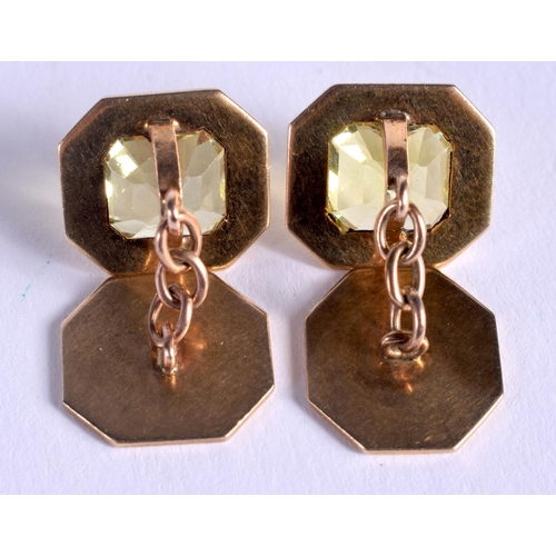 824 - A PAIR OF ART DECO GOLD AND YELLOW STONE CUFFLINKS possibly Yellow Sapphires. 9 grams. 1.5 cm x 1.3 ... 