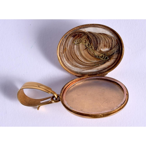 832 - AN ANTIQUE YELLOW METAL ENAMEL AND PEARL MOURNING LOCKET. 11 grams. 4.5 cm x 2.5 cm.