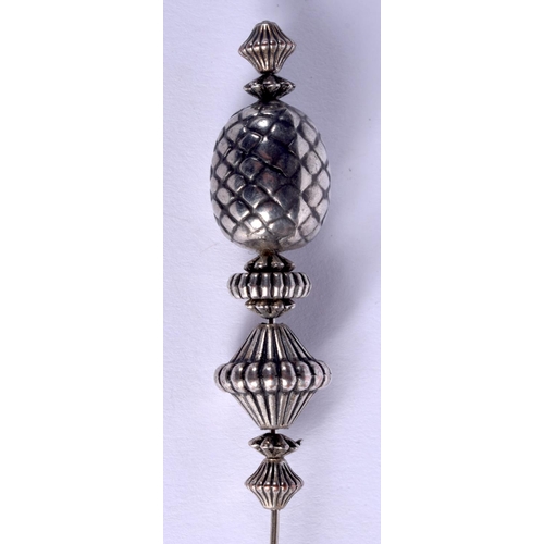 834 - AN ANTIQUE SCOTTISH SILVER HAT PIN. 7 grams. 13 cm long.