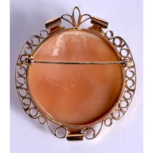 841 - A 9CT GOLD CAMEO BROOCH carved with a pretty female. 17 grams. 5 cm x 4.5 cm.