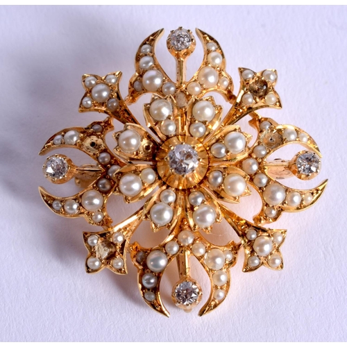 846 - A FINE VICTORIAN 15CT GOLD DIAMOND AND SEED PEARL STAR BROOCH. 10 grams. 3 cm x 3 cm.