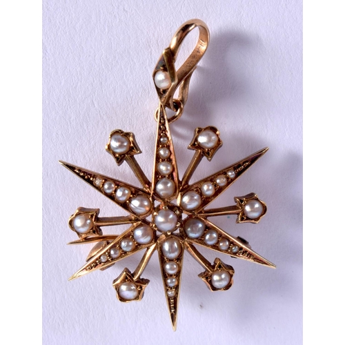 870 - A VICTORIAN 15CT GOLD STAR BROOCH. 5 cm wide.