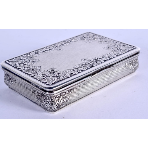 877 - A 1940 SILVER SNUFF BOX decorated with repousse foliage. 139 grams. 8.5 cm x 5.5 cm.