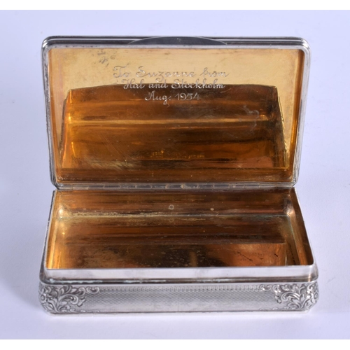 877 - A 1940 SILVER SNUFF BOX decorated with repousse foliage. 139 grams. 8.5 cm x 5.5 cm.