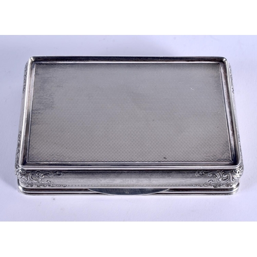 877 - A 1940 SILVER SNUFF BOX decorated with repousse foliage. 139 grams. 8.5 cm x 5.5 cm.