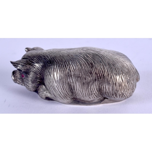 881 - A CONTINENTAL SILVER RUBY EYED FIGURE OF A PIG. 41 grams. 6 cm x 4 cm.