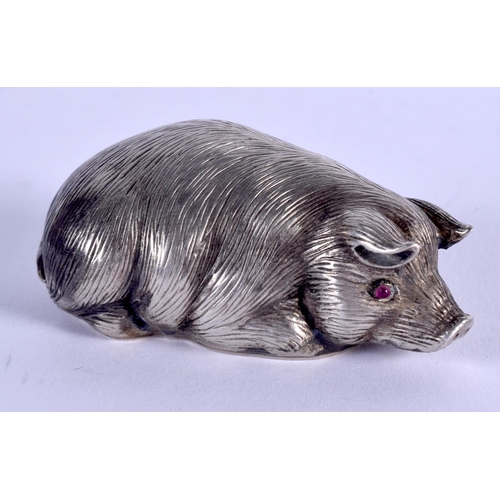 881 - A CONTINENTAL SILVER RUBY EYED FIGURE OF A PIG. 41 grams. 6 cm x 4 cm.