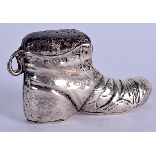 886 - AN ANTIQUE SILVER BOOT PIN CUSHION. 34 grams. 7.5 cm x 5 cm.