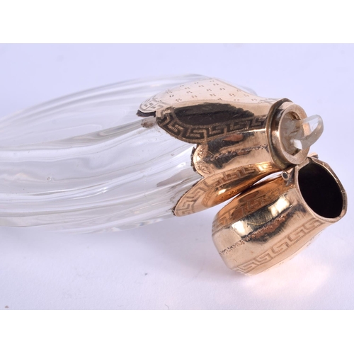 893 - A FRENCH 18CT GOLD AND CRYSTAL SCENT BOTTLE. 9.5 cm high.