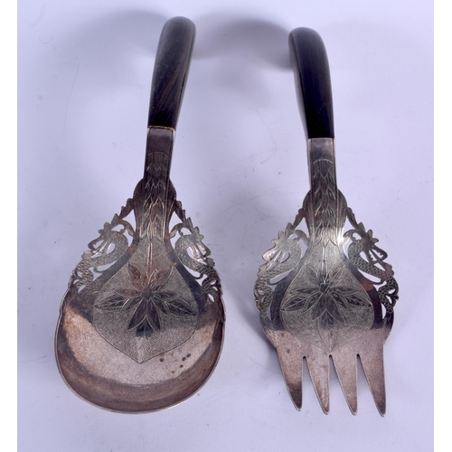 916 - A PAIR OF 19TH CENTURY MIDDLE EASTERN ISLAMIC SILVER SERVING TONGS. 141 grams. 18 cm long.