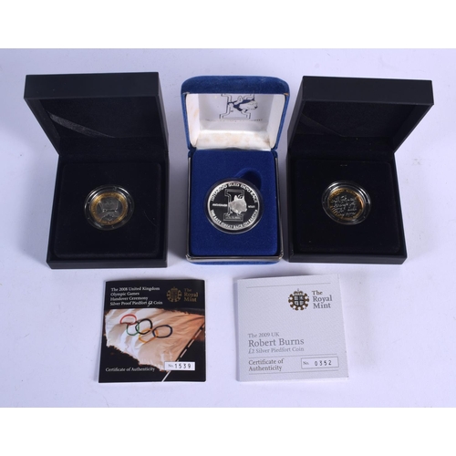 927 - THREE BOXED SILVER PROOF COINS. (3)