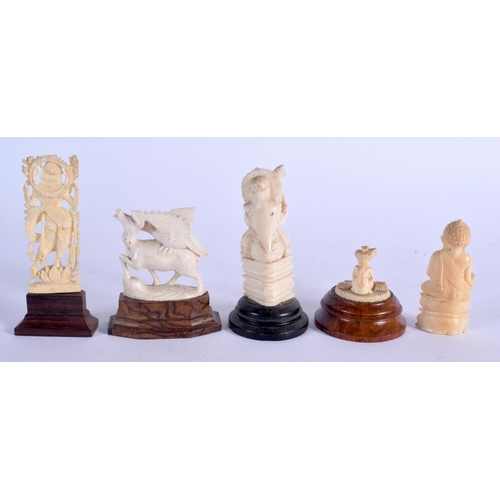 957 - A 19TH CENTURY ANGLO INDIAN CARVED IVORY SNAKE CHARMER together with four others. Largest 8 cm high.... 