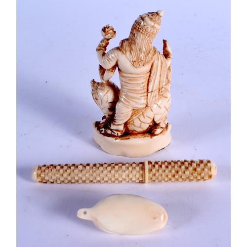 964 - A 19TH CENTURY ANGLO INDIAN CARVED IVORY BUDDHISTIC DEITY together with two others. Largest 9 cm lon... 