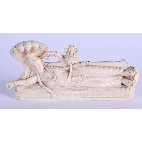 970 - A 19TH CENTURY ANGLO INDIAN CARVED IVORY BUDDHISTIC DEITY. 12 cm x 5 cm.