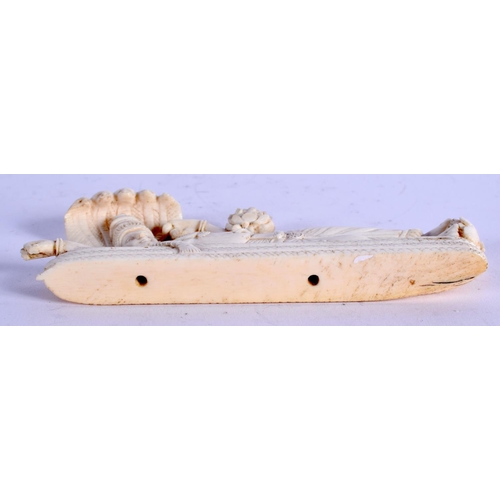 970 - A 19TH CENTURY ANGLO INDIAN CARVED IVORY BUDDHISTIC DEITY. 12 cm x 5 cm.