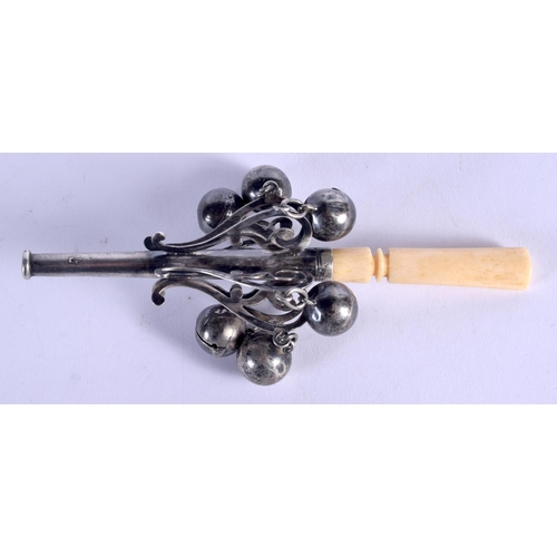 972 - A VICTORIAN SILVER AND IVORY BABIES RATTLE. 13 cm long.