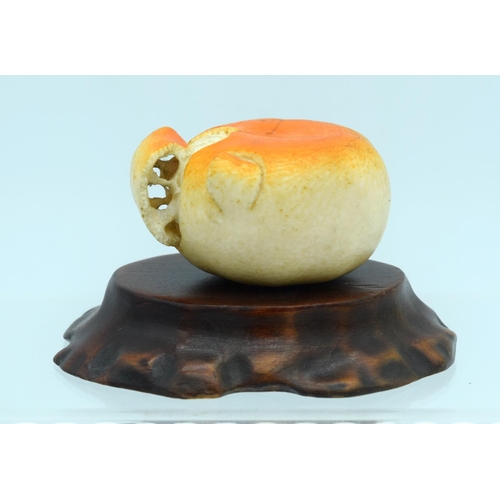 12 - A 19TH CENTURY JAPANESE MEIJI PERIOD CARVED IVORY OKIMONO modelled as peeled tangerine. Okimono 5 cm... 