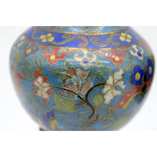 33 - A PAIR OF 19TH CENTURY CHINESE CLOISONNE ENAMEL VASES decorated with foliage and vines. 12 cm high.