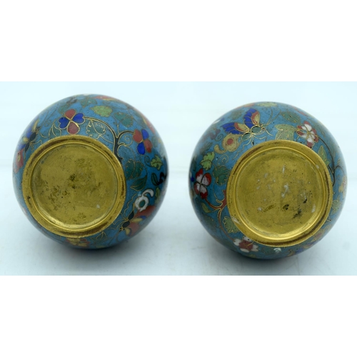 33 - A PAIR OF 19TH CENTURY CHINESE CLOISONNE ENAMEL VASES decorated with foliage and vines. 12 cm high.