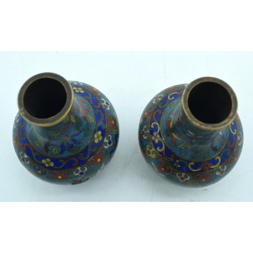 33 - A PAIR OF 19TH CENTURY CHINESE CLOISONNE ENAMEL VASES decorated with foliage and vines. 12 cm high.