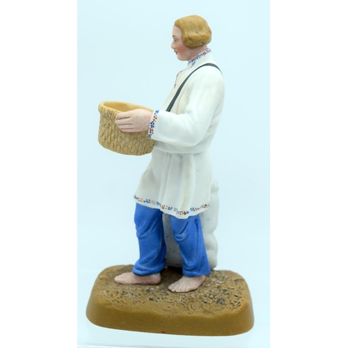 45 - A 19TH CENTURY RUSSIAN BISQUE PORCELAIN FIGURE OF A FARMER Attributed to the Gardner factory, modell... 