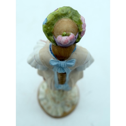 51 - A 19TH CENTURY RUSSIAN BISQUE PORCELAIN FIGURE OF A STANDING FEMALE Gardner factory, modelled as a f... 