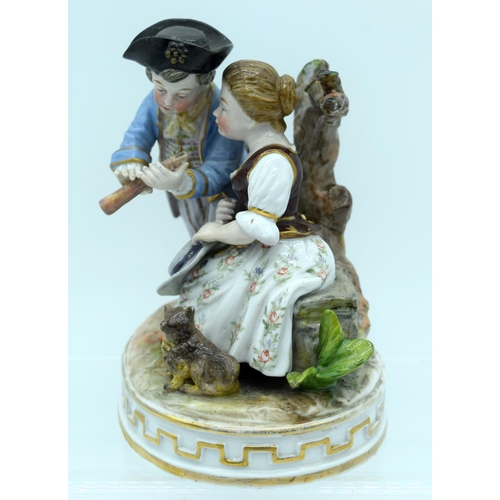53 - AN ANTIQUE GERMAN PORCELAIN FIGURAL GROUP modelled as a boy and girl playing a pipe. 13 cm x 11 cm.