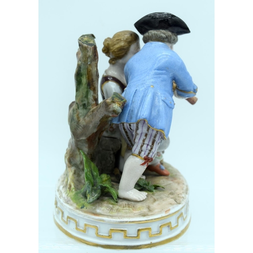 53 - AN ANTIQUE GERMAN PORCELAIN FIGURAL GROUP modelled as a boy and girl playing a pipe. 13 cm x 11 cm.