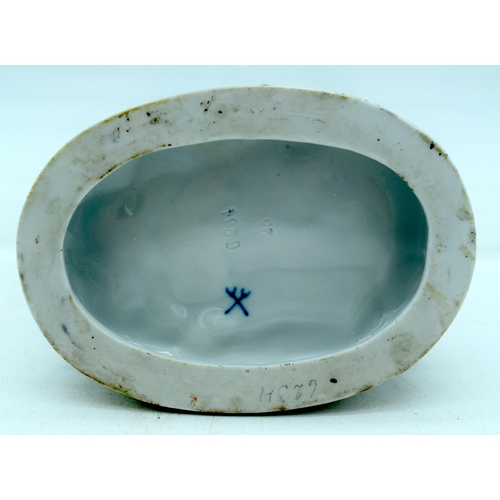 53 - AN ANTIQUE GERMAN PORCELAIN FIGURAL GROUP modelled as a boy and girl playing a pipe. 13 cm x 11 cm.