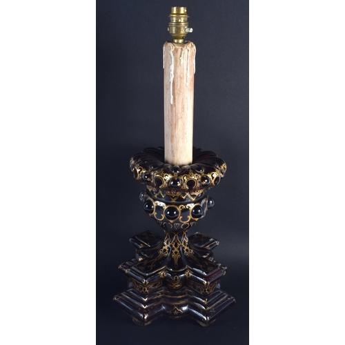 10 - A LARGE 19TH CENTURY BOHEMIAN ISLAMIC STYLE RUBY GLASS CANDLESTICK painted with gilt foliage and mot... 