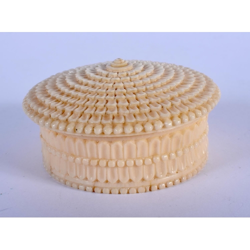 1008 - A FINE 19TH CENTURY EUROPEAN CARVED IVORY BOX AND COVER of almost floral form. 6.5 cm diameter.