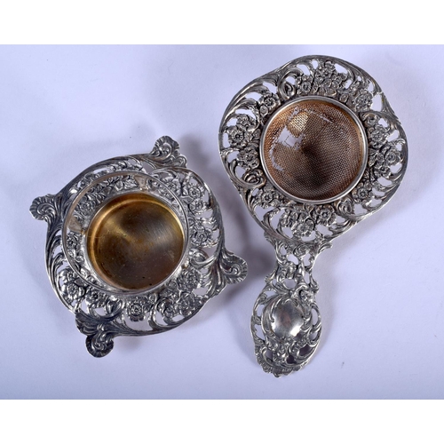 1032 - A 19TH CENTURY CONTINENTAL SILVER TEA STRAINER ON STAND. 87 grams. 12 cm x 7 cm. (2)