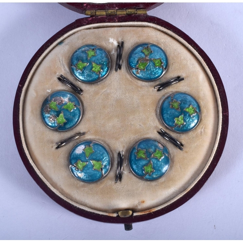 1038 - A CASED SET OF SIX SILVER AND ENAMEL BUTTONS. 13 grams. 1.5 cm diameter. (6)