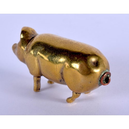 1053 - A RARE ANTIQUE BRASS PIGGY LIPSTICK HOLDER. 4.5 cm x 2 cm.