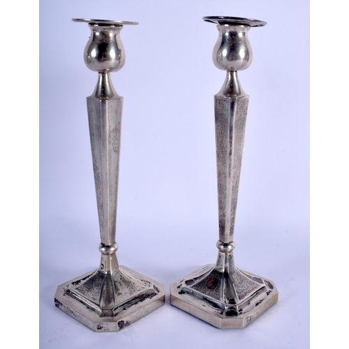 1060 - A PAIR OF LATE 19TH CENTURY CHINESE EXPORT SILVER CANDLESTICKS of hammered form. 750 grams overall. ... 