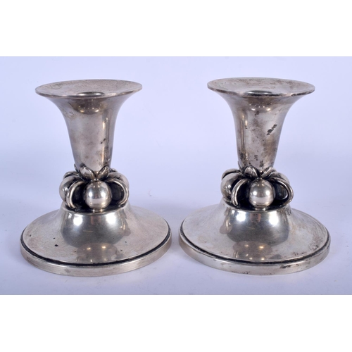 1061 - A PAIR OF STERLING SILVER GEORG JENSEN TYPE CANDLESTICKS. 370 grams. 11 cm x 7 cm.