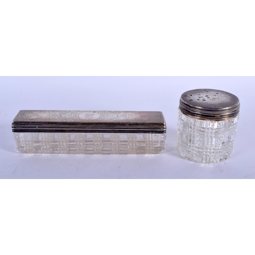 1085 - TWO VICTORIAN SILVER TOPPED CRYSTAL GLASS JARS. Silver 110 grams. Largest 16 cm x 4 cm. (2)