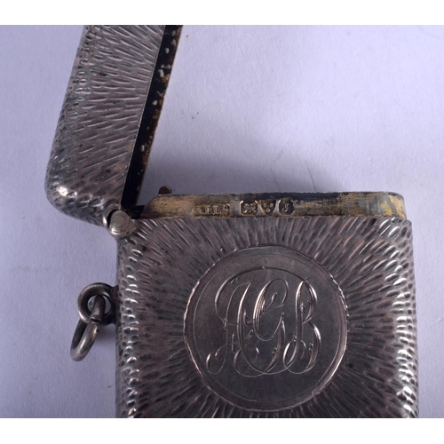 1086 - AN ANTIQUE SILVER FOB WATCH together with a silver purse & silver vesta case. 177 grams overall. Lar... 