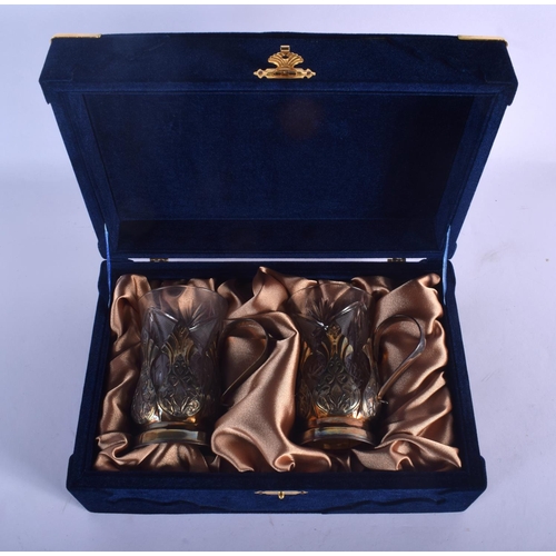 1106 - A CASED PAIR OF VINTAGE RUSSIAN SILVER CUPS with cut crystal body. 180 grams. 11 cm x 8 cm.